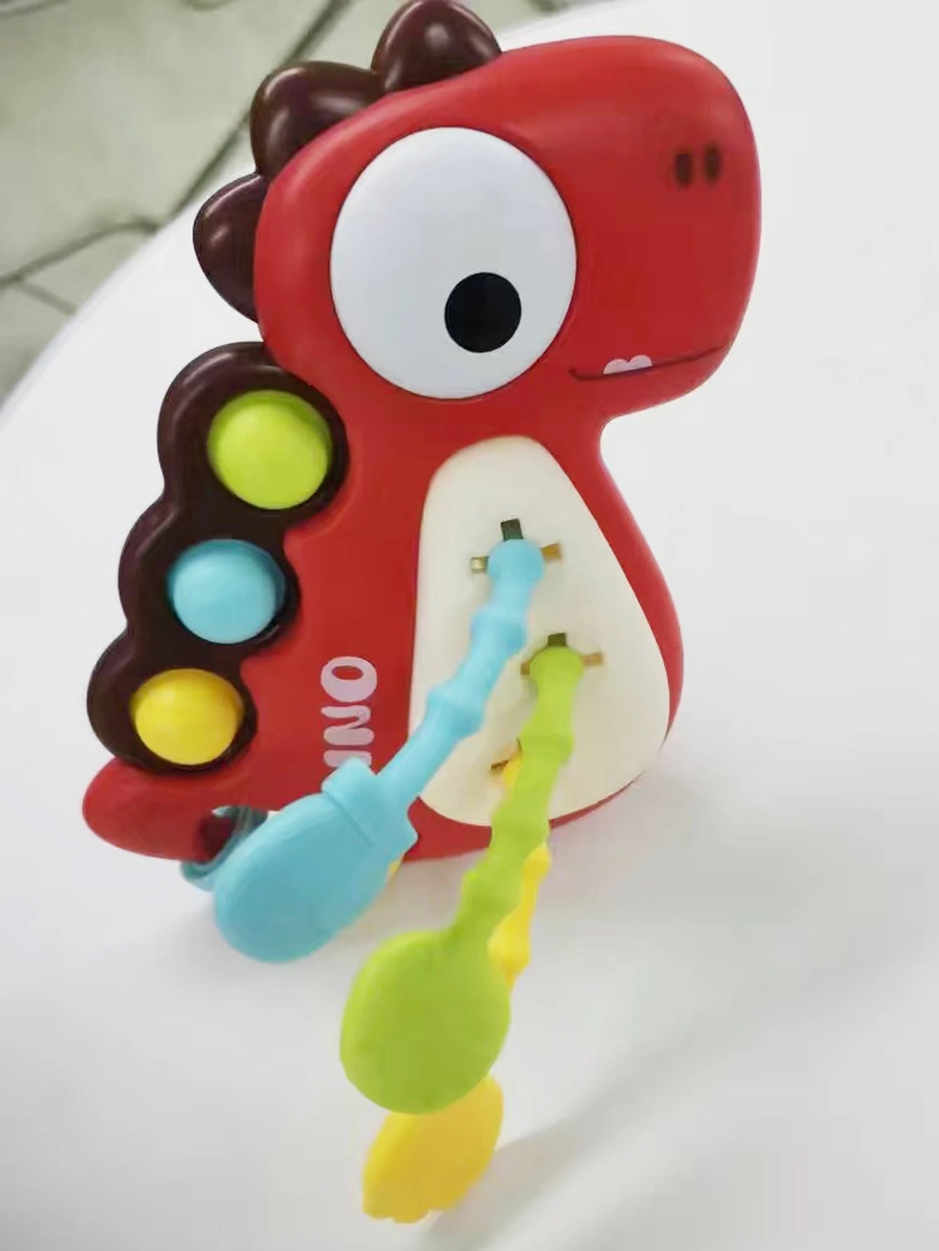 Dinosaur Busy Board Toy with Montessori-Inspired Design, Pull Strings, Multi-Color, Safe for Months 6+