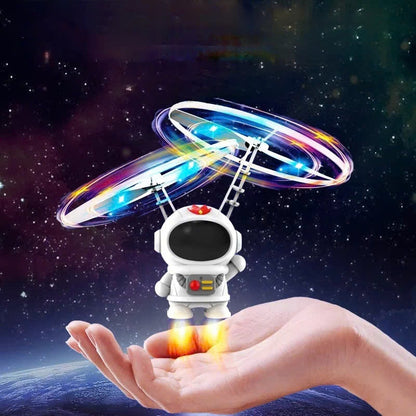 Interactive Flying Mini Astronaut Drone – Hand-Controlled Robot Toy with Lights, Perfect Outdoor Fun Gift for Kids